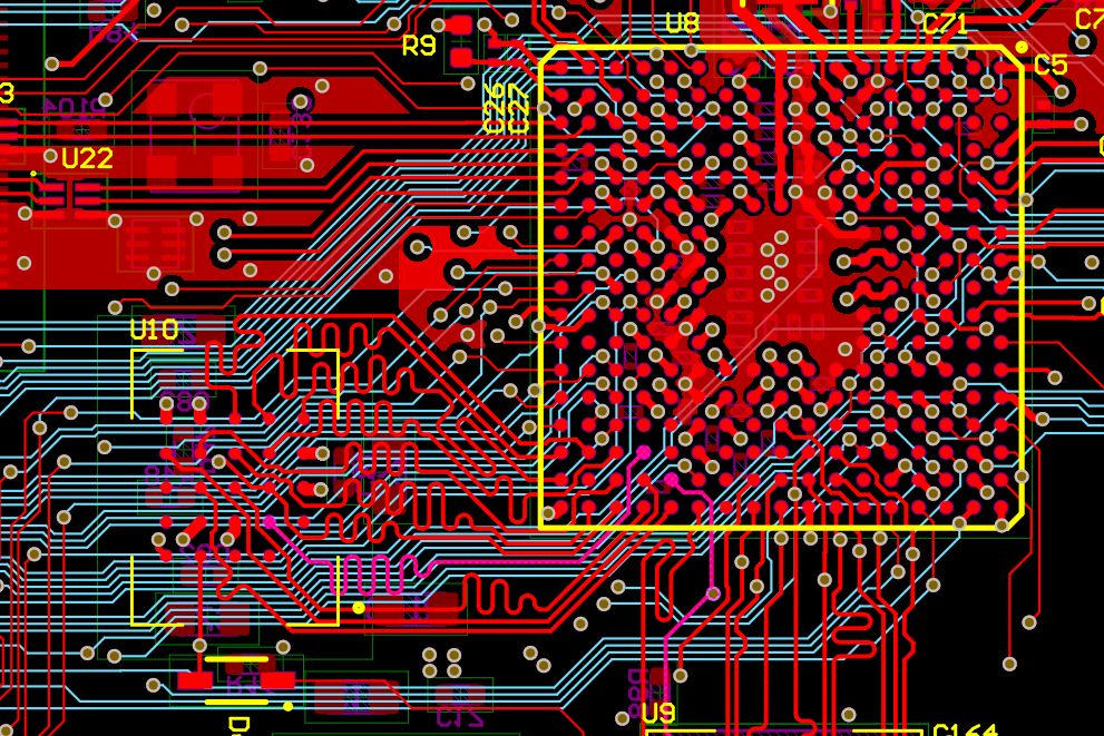 A dense board layout: traces fanning out from a large BGA, with delay-tuned meanders